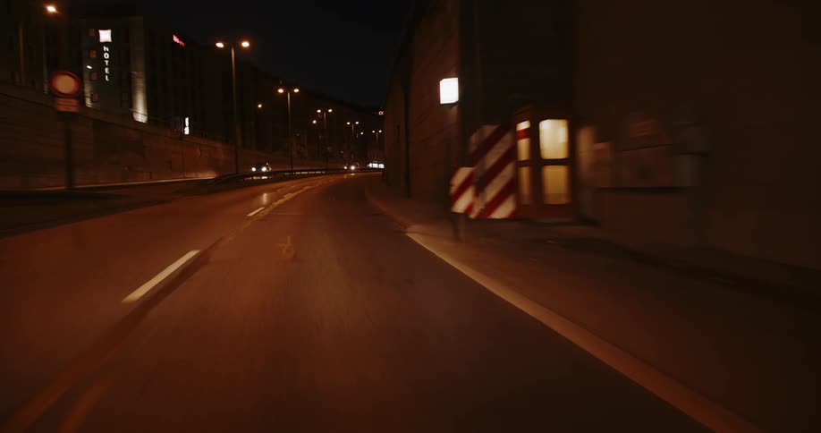 Cars travel into the tunnel at night