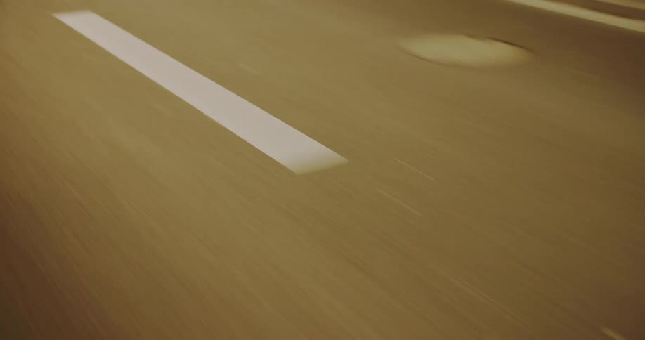 A car travels on the road at night