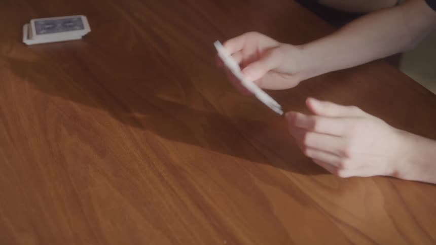 A woman lays her cards on the table