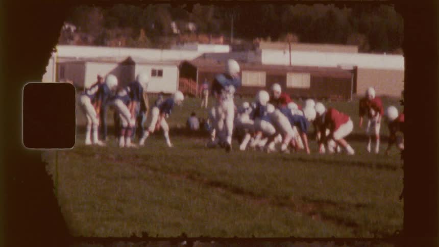 A football player runs across the field