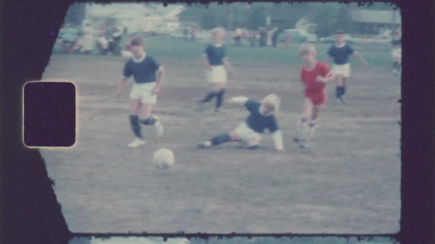 Children are playing soccer together