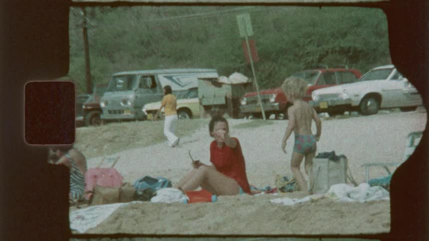 Many people on a beach playing and enjoying the summer