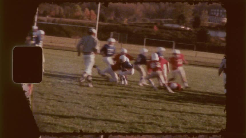 A football player is tackled during a game