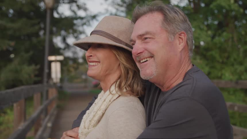 A man is hugging a woman on the trail