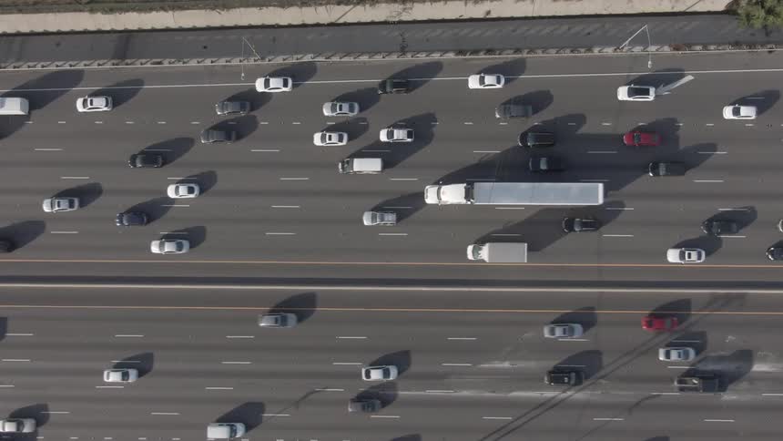 Traffic moves on a busy highway