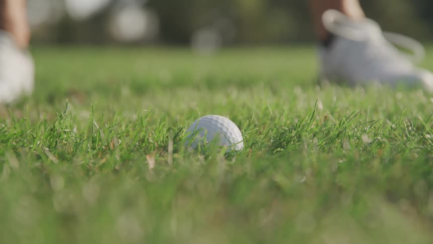 A golf ball is hit on the grass