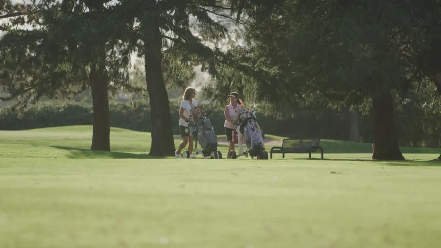 A footage of people walking the golf course