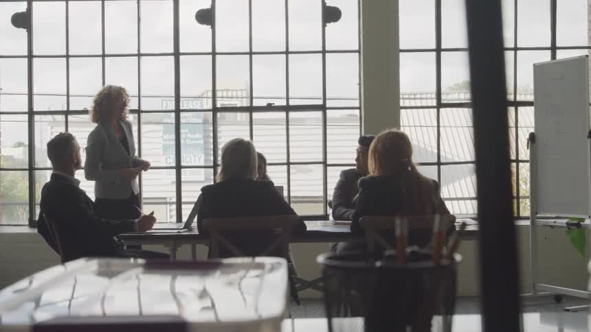 People in a meeting in an office discussing