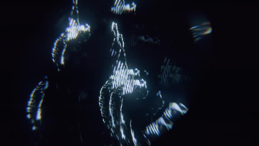 A hologram projects women dancing all over the screen