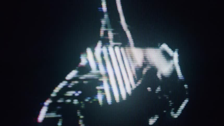 The hologram of a woman dancing leans back