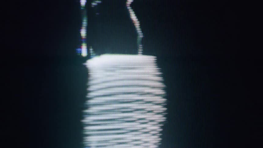 The hologram is of a woman dancing as static blinks