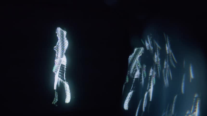 A hologram of a woman slowly dances