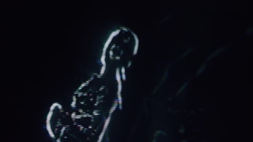 The hologram of a woman spins