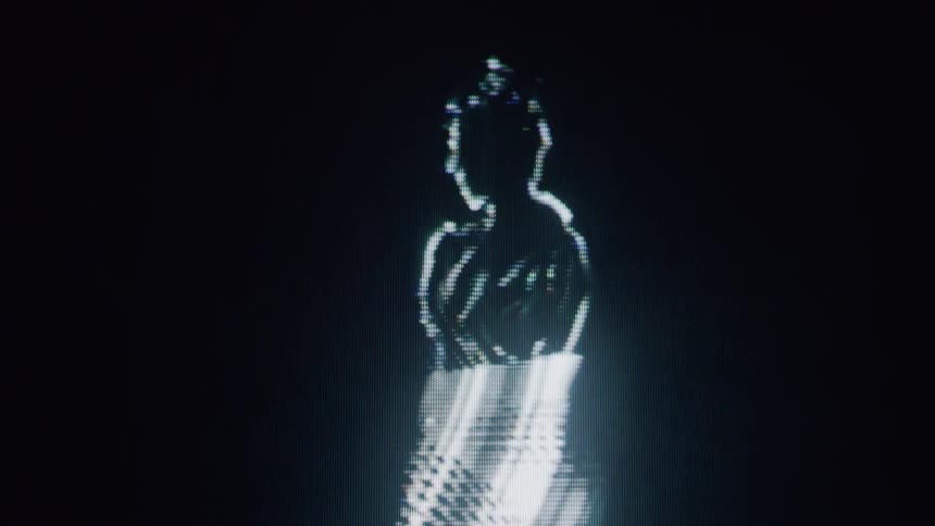 The hologram shows a woman dancing