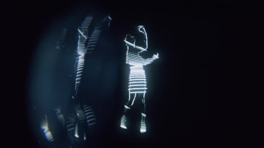 The bright hologram shows a person dancing