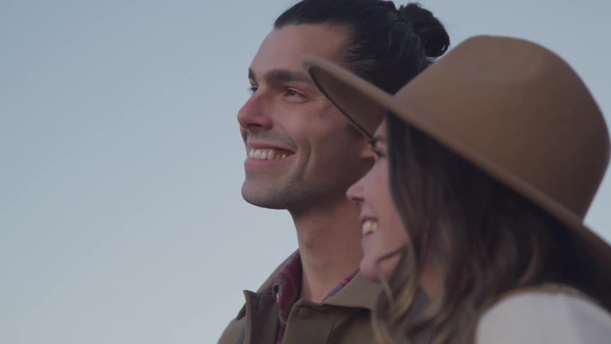 2 young people looking at each other smiling