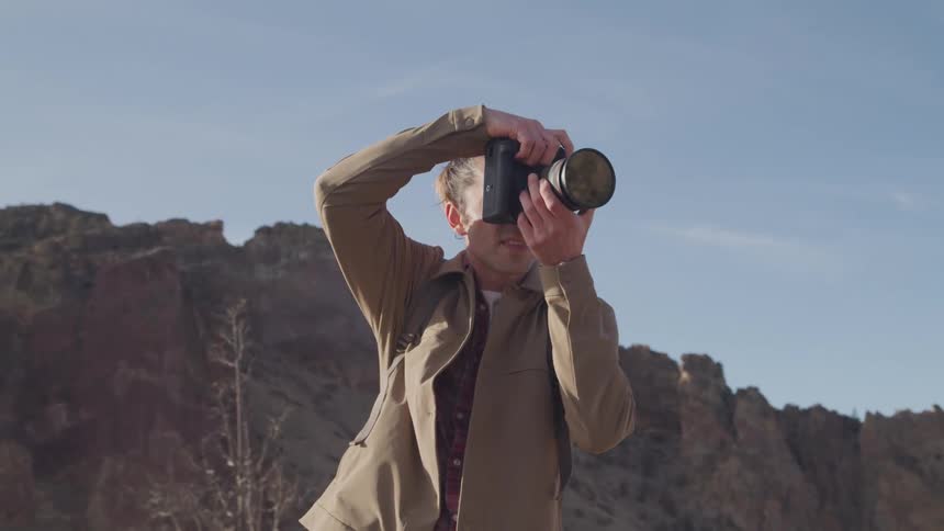 A footage of a male taking a photograph