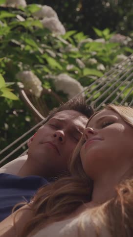 A couple sleep in the hammock