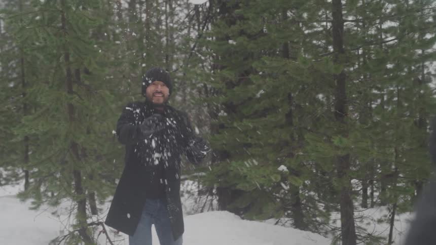 A footage of a person throwing snowballs