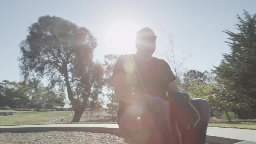 An adult riding a child ride