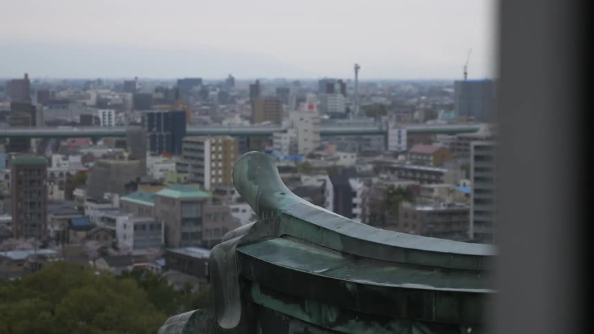 The city below has heavy clouds above