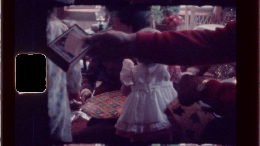 Family exchanging gifts during the winter holidays
