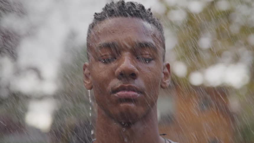 Rain pours down on the teenagers head