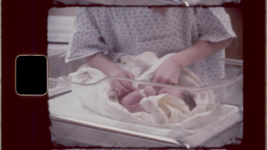 A mother is touching her daughter in the hospital