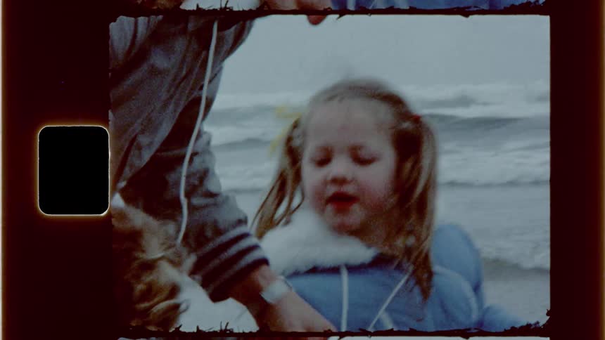 Father and daughters playing at the beach
