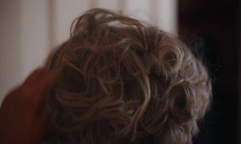 Lady fixing her hair