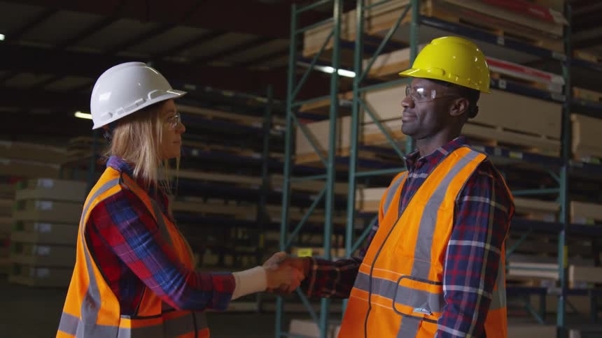 A footage of two workers in a warehouse