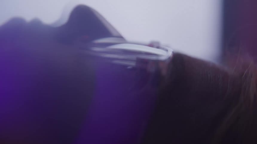Vibrations cause a persons head to shake with lights flashing behind
