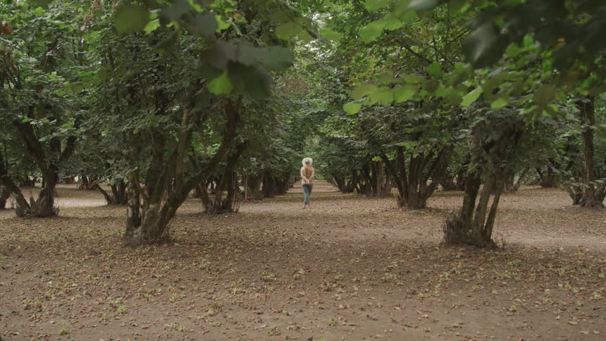 Girl in the middle of nature with many trees