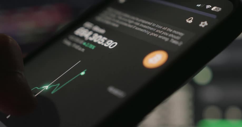 A person drags their finger across the graph on the phone