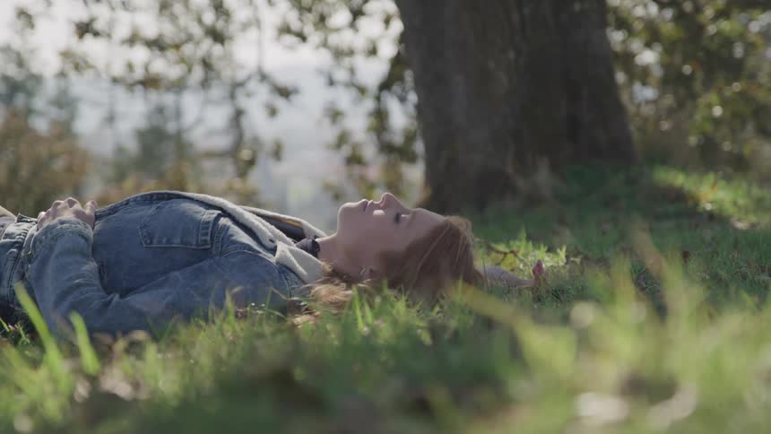 Girl lying on a meadow
