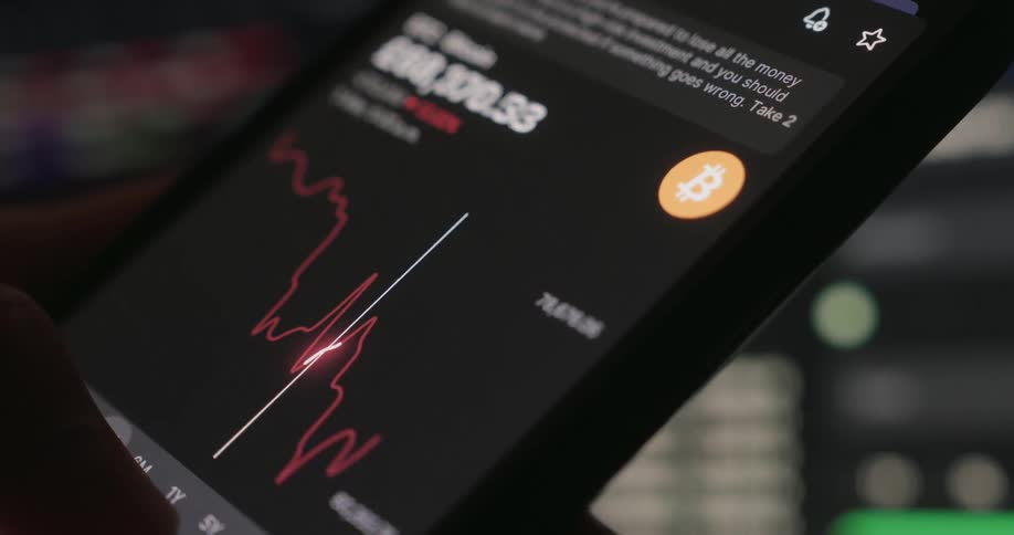 Cell phone screen with the graph of the value of bitcoins