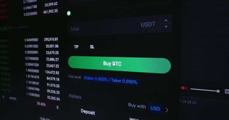 The camera pans in and right over a display showing the current price of btc before focusing on the mouse pointer hovering over a large green button captioned buy btc