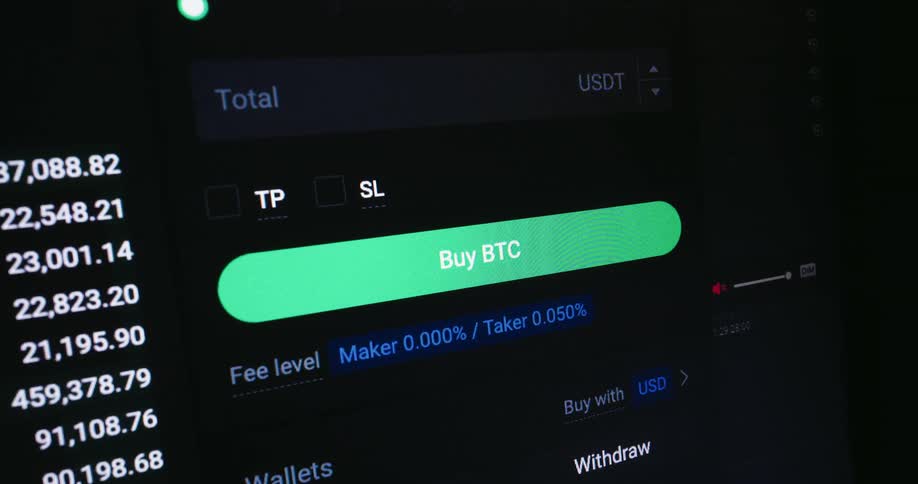 Computer monitor displaying graphs and current numbers for available cryptocurrency