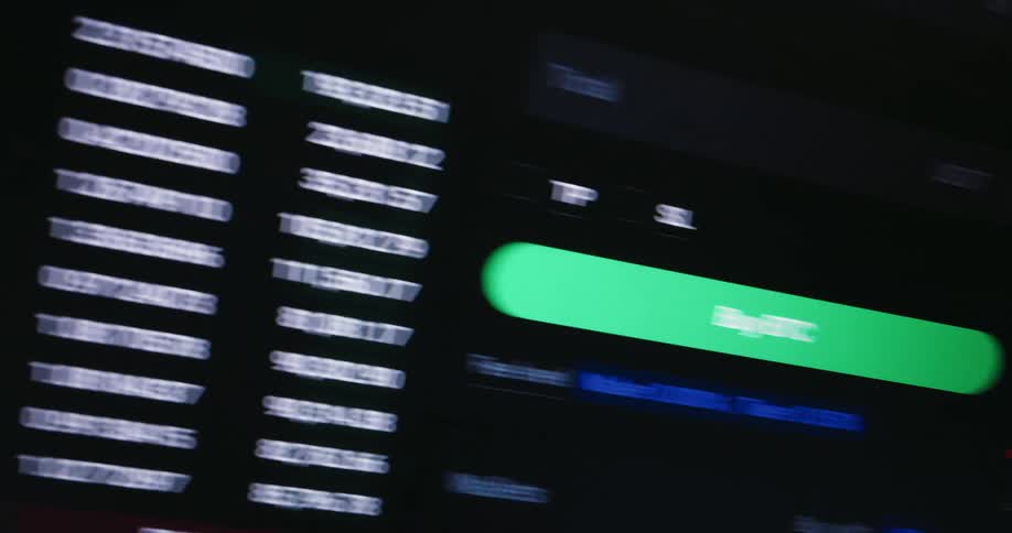 Angled shots of a screen showing rapidly fluctuating data from a bitcoin exchange