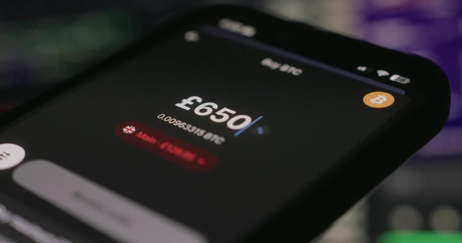 Person inputs numbers to purchase cryptocurrency on their smartphone