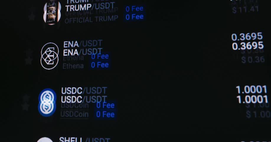 A list of cryptocurrencies flashes on the screen
