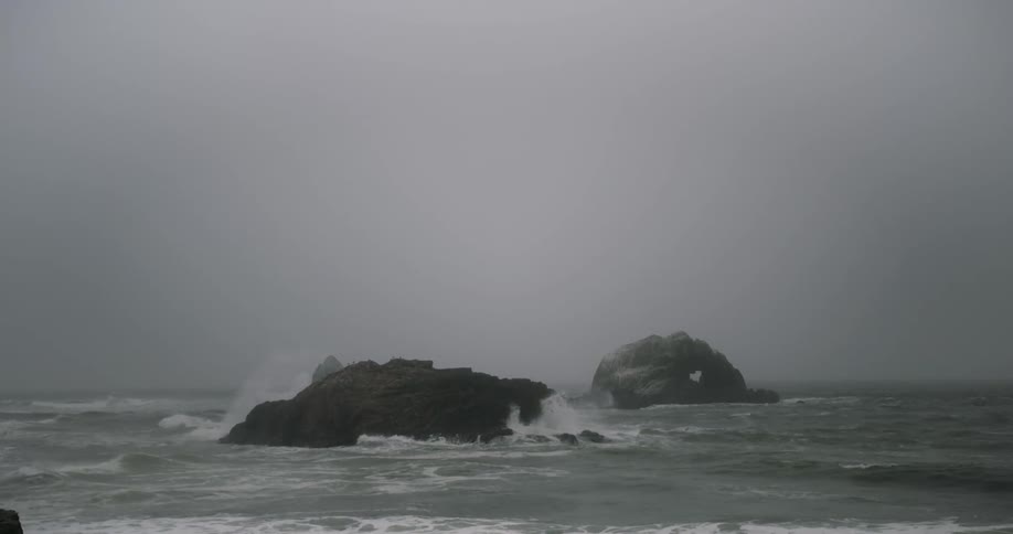 A view of water with  large rocks in it