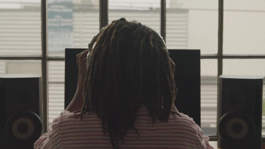 Boy wearing headphones to music
