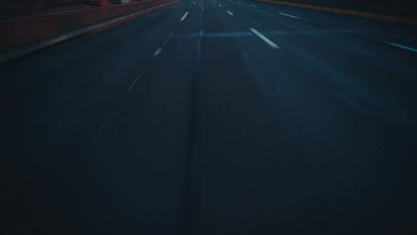 The road is shown from the point of view of something driving fast