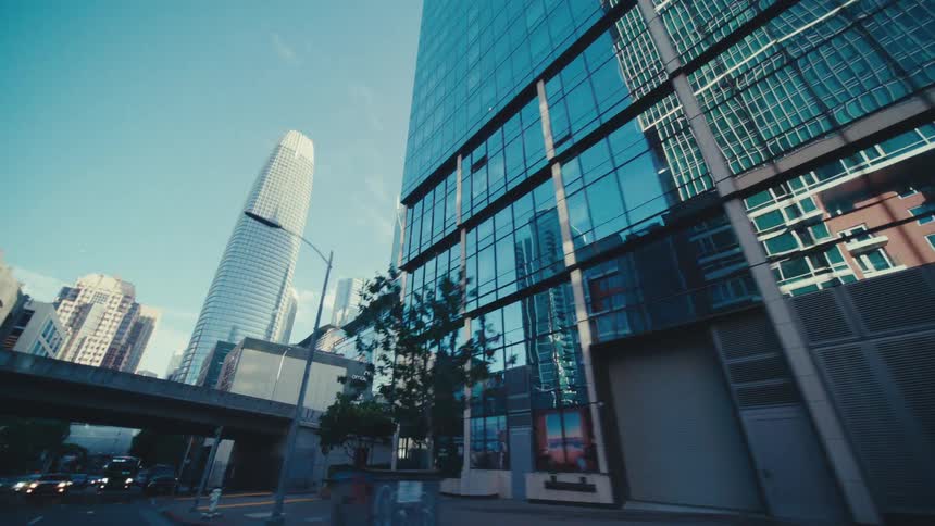 The tall buildings have mirrored windows