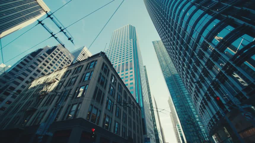 A metropolis is shown from below with several tall towers