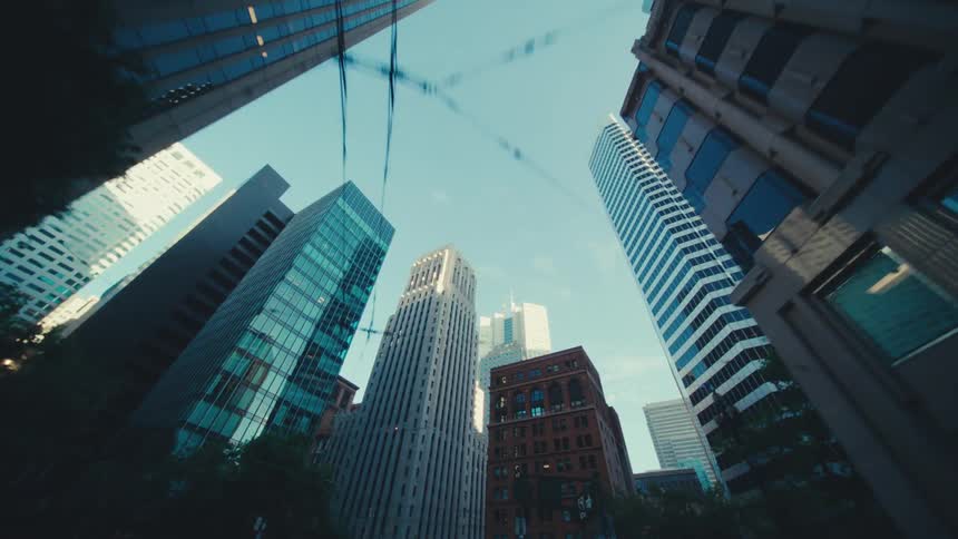 Skyscrapers in a city reflect the sunlight