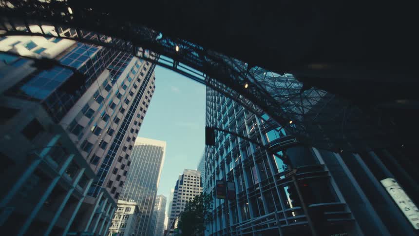 Skyscrapers are outside the small tunnel