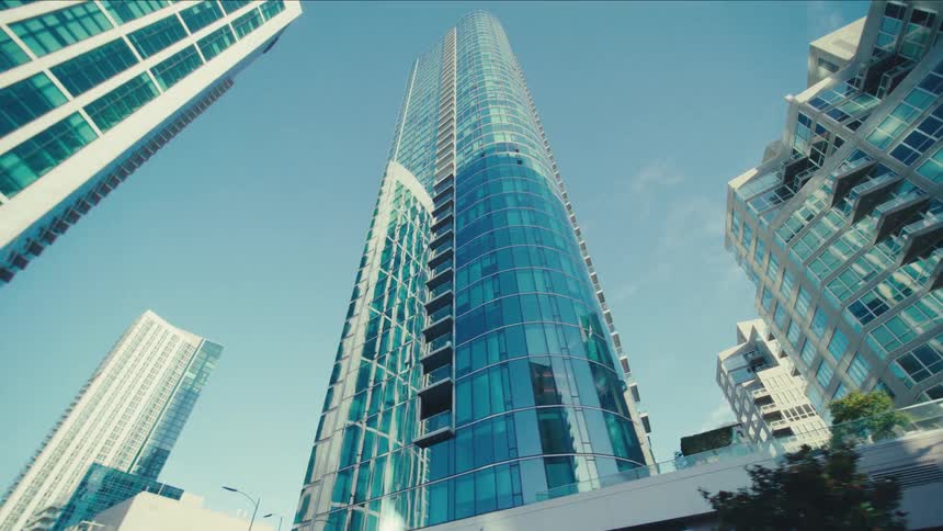 Sunlight is reflecting on the windows of tall skyscrapers