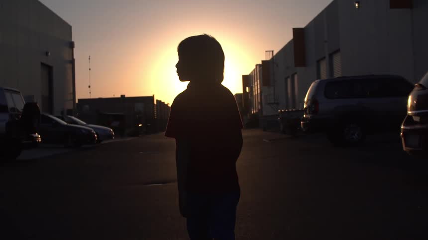 A person blocking the sunset